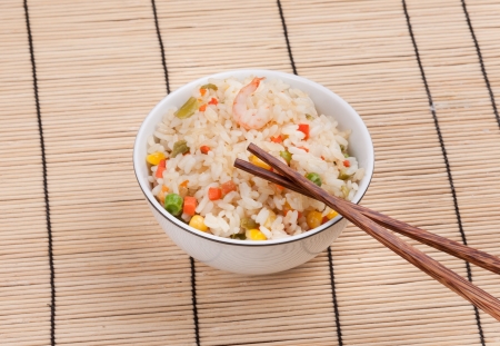 Fried rice dish with vegetables and prawnの写真素材