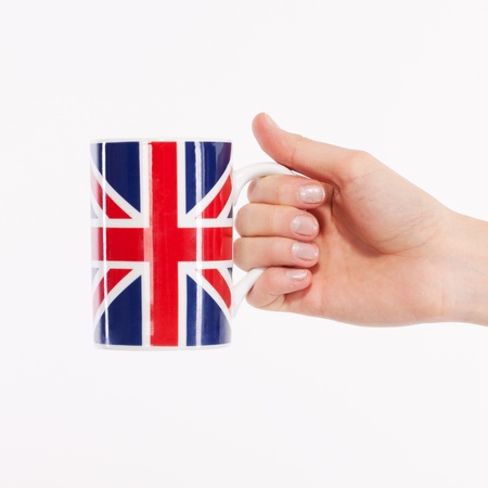 Hand with british cup on whiteの写真素材