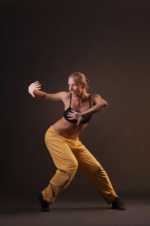 young beautiful blonde woman in motionの写真素材