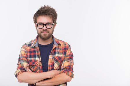 Profile of cute bearded man with his arms crossed. Short-haired man in glasses smiling isolated on white background.の写真素材