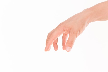 Business concept. Well-shaped male hand and arm reaching for something isolated on white background.の写真素材