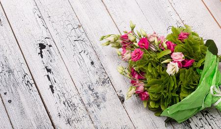 Image of beautiful bouquet of flowers represented in studio. Pink, white roses and many greenery among them. Wedding or Valentine's concepts.の写真素材