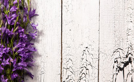 Lavender flowers over wooden background with blank space for your ideas. Beautiful flowers represented on left side.の写真素材