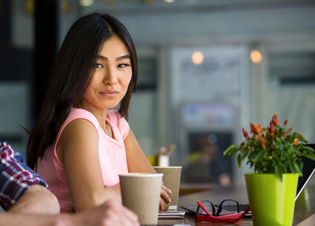 Portrait of beautiful freelance woman looking at camera.の写真素材