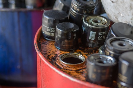 Picture of automobile oil filters from motor or engine background. Many filters for cars or automobiles isolated. Image made in Kiev, Ukraine.のeditorial素材