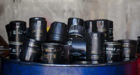 Closeup picture of car oil filters or air filters. Old fuel filters isolated on automobile service center. Image made in Kiev, Ukraine.のeditorial素材
