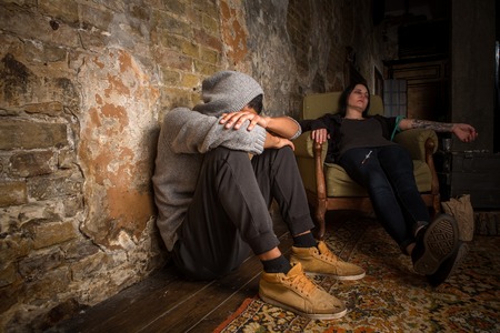 Drugs concept. Drug addict sleeping after taking drugs. Man and woman with AIDS resting and relaxing. Disease concept.の写真素材