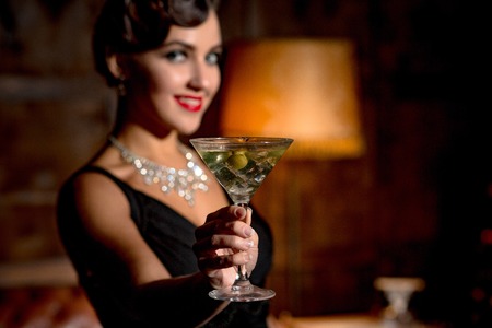 Vamp lady with red lips in restaurantの写真素材