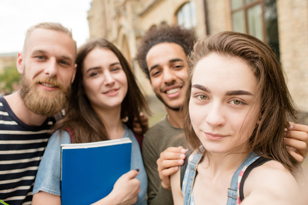 Multiethnic students smiling for selfie photo.の写真素材