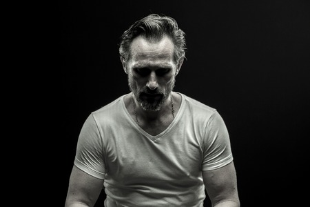Black and white portrait of mid aged man.