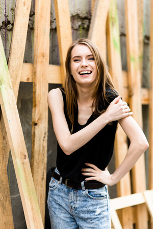 Pretty young woman with joyful smile. Sensual girl in casual clothes with happy smile in face.の写真素材