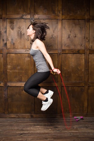 Active girl jumping on skipping rope. sport concept.の写真素材