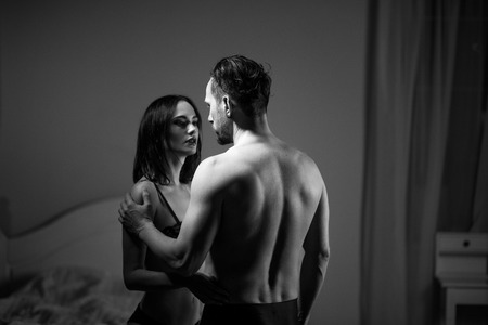 Erotic couple standing and holding each other. Passion concept.の写真素材