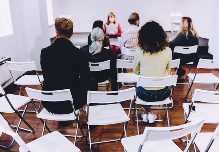 Back view image of addicted people. Listening to psychologist. Toned concept.の写真素材