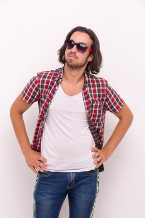 Happy brunette male in sunglassess. Looking side away.の写真素材