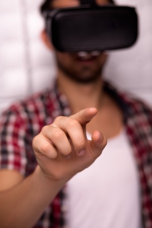 Close up of man in virtual reality glasseess. Future concept.