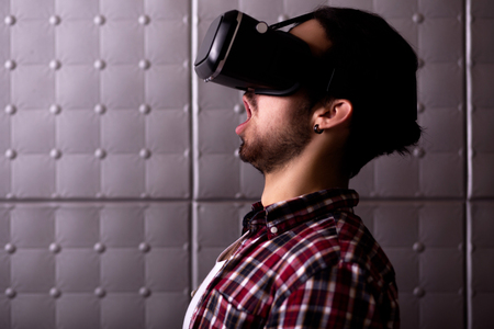 young man in virtual reality glassess. looking aside.の写真素材