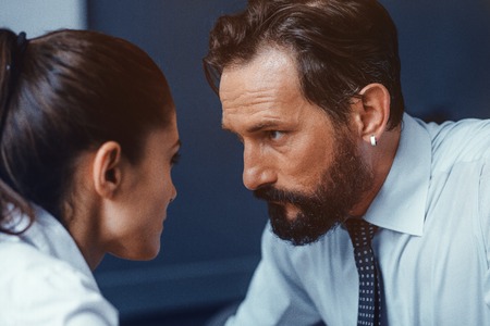 Young businessman and businesswoman compete with each other in business. Fight of genders concept.の写真素材