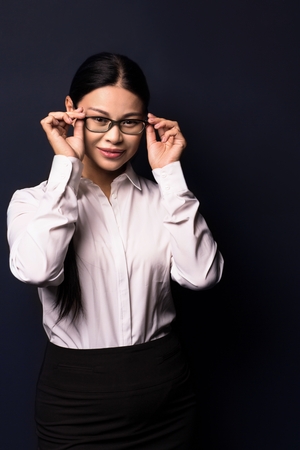 Business woman in fashion clothes and glasses posing on camera. Woman in business concept.の写真素材