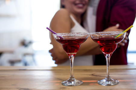 Beauty Couple Having Fun At Cafe With Cocktails. Dating Period. Love Story Concept.