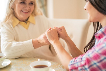 Close-up On Women Holding Hands. Close Up Shot Of Mother And Daughters Hands Holding Togetherの写真素材