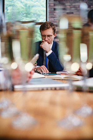 Business man after a business meeting. He thought about the business proposal. Close-up shot