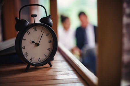 Watches are one of the main details of the interior in the office. In the background office workers...