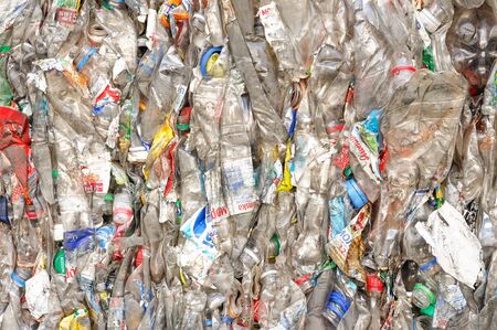 Plastic Bottles in Extruded Form at a Plant for Processing Raw Materials. PET Recycling Plant. Close Up Shoot.のeditorial素材