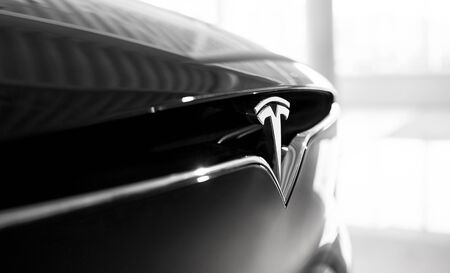 Close-Up Tesla Logo Sign. Beautiful Electric Vehicle is Future Automobile of Planet. Black and White Shot. Kyiv, Ukraine, F-Drive showroom 13 of february 2018.のeditorial素材