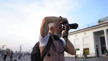 A Professional Traveler Photographer Pulls The Trigger To Capture A Beautiful Cityscape. View In Profile.の写真素材