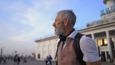 Attractive Intelligent Man Admires The Beautiful View Of The Evening City. View In Profile.