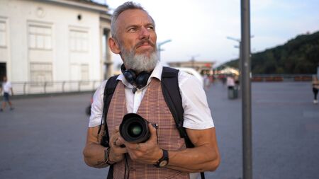 Intelligent European Man Looking For A Goal To Make Beautiful Shots For His Blog.の写真素材