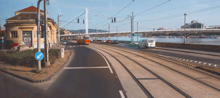 Embankment in Budapest. Spacious paved street of a modern European city on a warm sunny day. Danube River on the background. May, 2013. Budapest, Hungary.のeditorial素材