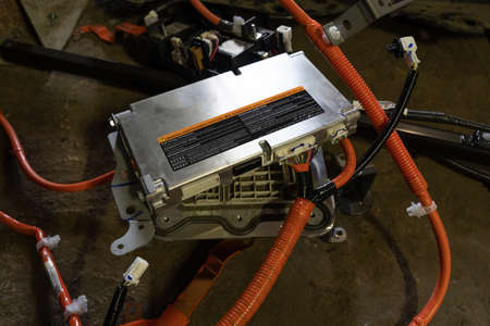 BMS or battery management system from an electric car Nissan Leaf. High angle view. At service...