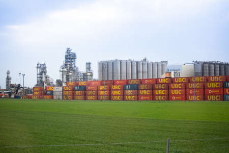 Rows of containers for transportation of goods from ubc Transport Logistics Company against on...