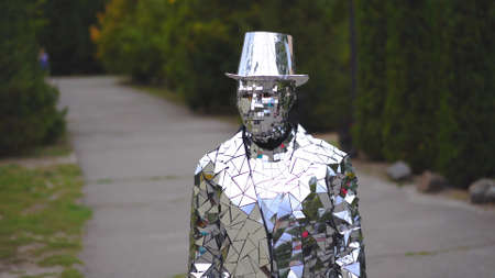 Unusual Man In Mirror Suit And Hat Is Standing In The Street Like Statue Or Monument. Ukraine- Kyiv- Restaurant Dva Bobra- 09.07.2018のeditorial素材