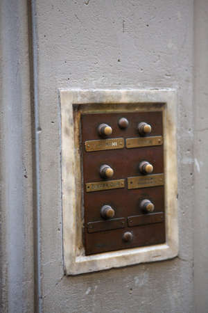Retro intercom at building entrance. Selective focus on nameplate with Europa Club inscription in centre of image. May, 2013. Pisa, Italy.のeditorial素材