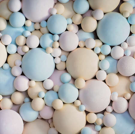Abstract 3d background with pastel colors matte balls. delicate blue, pink, beige balls different...