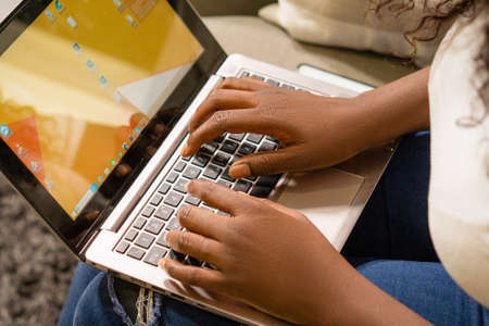 Afro American Female Hands Typing on the Laptop Keyboard, Dark Skinned Person Working on Laptop....