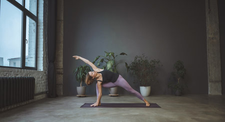 Yoga for beginners. Asana for beautiful legs and buttocks. Taking care of body and mental health. High quality photoの写真素材