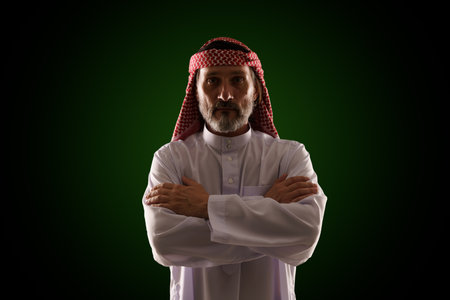 Arab man in traditional Islamic clothing and immersed in Sharia culture, with emphasis on religious customs, architecture, and lifestyle. Essence of Middle Eastern heritage, history, and spirituality. High quality photoの写真素材