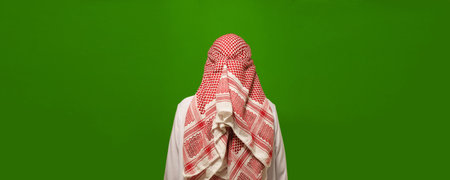 reverse side of Islam, using back view of man in Arabic clothes. hidden and unknown aspects of Islamic culture, inviting viewer to explore enigmatic and spiritual dimensions of religion. High quality photoの写真素材