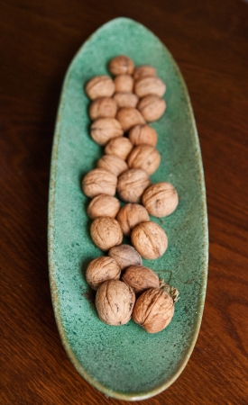 Walnuts in a green clay bowl