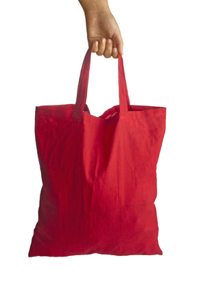 Red shopping bag in handの写真素材
