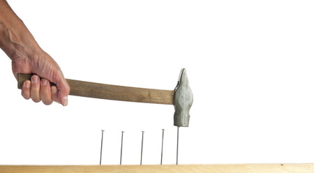 Man with a hammer and nailsの写真素材