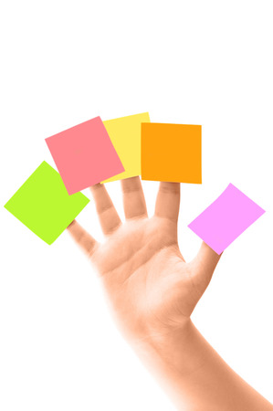 Five note papers on fingersの写真素材