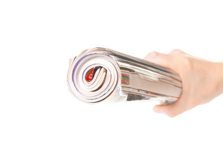 Hand holding a magazineの写真素材