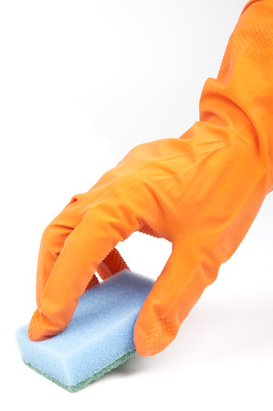 Hand in rubber glove and kitchen spongeの写真素材