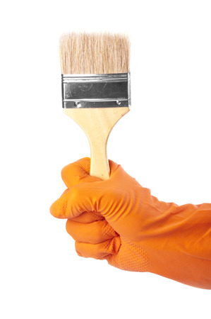 Hand in rubber glove holding brushの写真素材