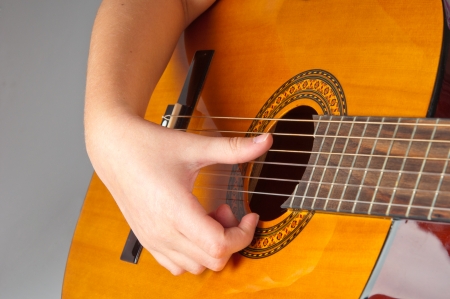 Girl playing acoustic guitarの写真素材